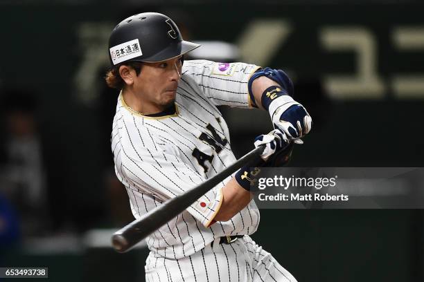 Infielder Nobuhiro Matsuda of Japan hits a grounder in the bottom of the fourth inning during the World Baseball Classic Pool E Game Six between...