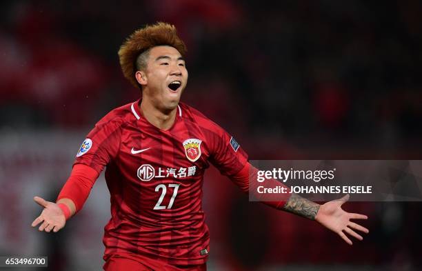 Shanghai SIPG' Shi Ke celebrates his goal during the AFC Asian Champions League group football match between China's Shanghai SIPG and Japan's Urawa...