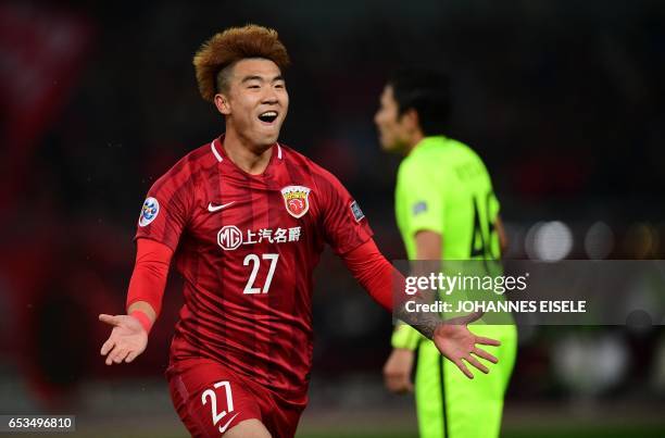 Shanghai SIPG' Shi Ke celebrates his goal during the AFC Asian Champions League group football match between China's Shanghai SIPG and Japan's Urawa...