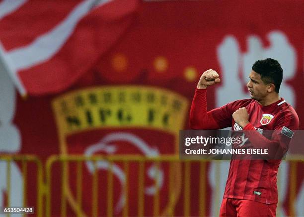 Shanghai SIPG' Brazilian forward Elkeson celebrates after scoring a goal during the AFC Asian Champions League group football match between China's...