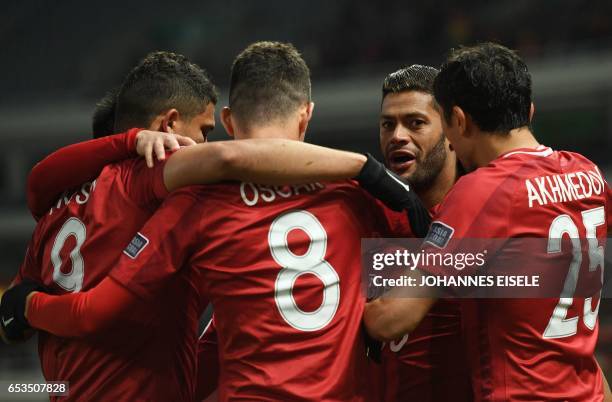 Shanghai SIPG' Brazilian forward Hulk celebrates with teammates after scoring a goal during the AFC Asian Champions League group football match...