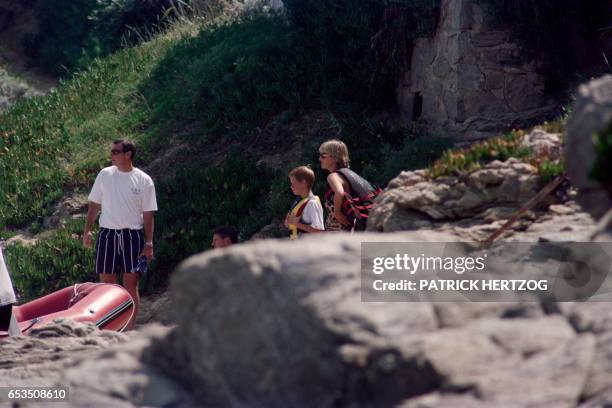 Photo taken on July 14, 1997 shows Britain's Lady Diana spending holidays with her son Harry near the property of her friend Dodi Al-Fayed in Saint...