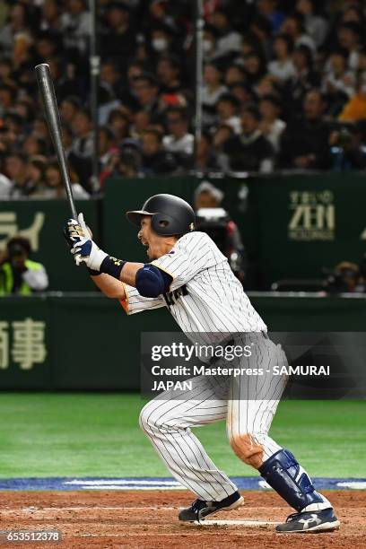 Infielder Nobuhiro Matsuda of Japan hits a RBI single to make it 0-8 in the bottom of the eighth inning during the World Baseball Classic Pool E Game...