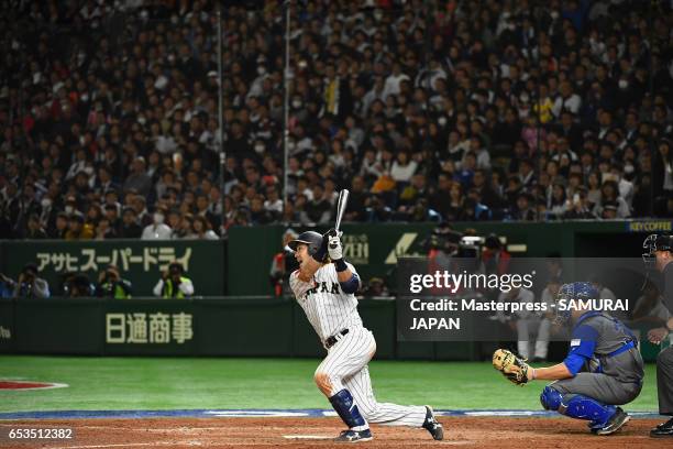 Infielder Nobuhiro Matsuda of Japan hits a RBI single to make it 0-8 in the bottom of the eighth inning during the World Baseball Classic Pool E Game...