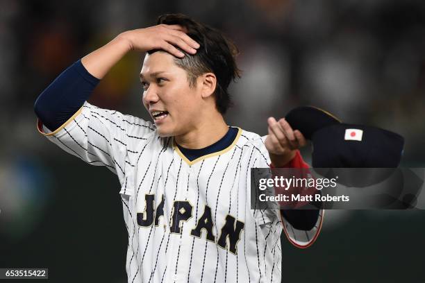 Infielder Hayato Sakamoto of Japan celebrates after the World Baseball Classic Pool E Game Six between Israel and Japan at the Tokyo Dome on March...