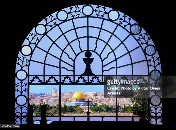 view of old jerusalem and the dome of the rock seen from inside dominus flevit church in the mount of olives or mount olivet in jerusalem, israel - mount of olives stock pictures, royalty-free photos & images