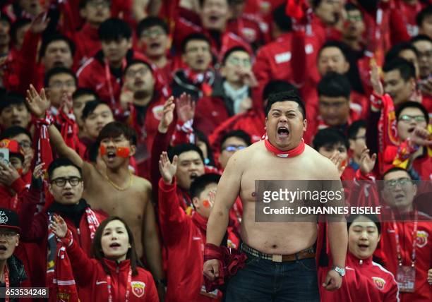 Shanghai SIPG supporters cheer for their team during the AFC Asian Champions League group football match between Shanghai SIPG and Urawa Red Diamonds...