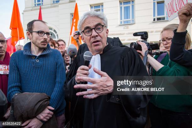 Former PricewaterhouseCoopers employee, Antoine Deltour listens to his lawyer William Bourdon speaking as they leave the Luxembourg Court of Appeal...