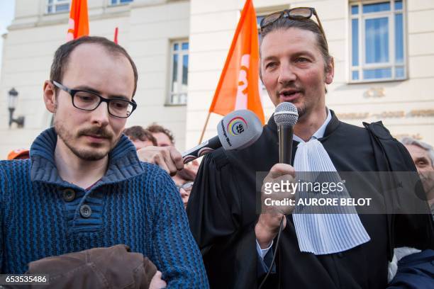 Former PricewaterhouseCoopers employee, Antoine Deltour listens to his lawyer Philippe Penning speaking as they leave the Luxembourg Court of Appeal...
