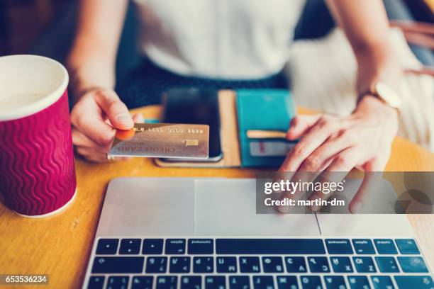 paying online with credit card - shopaholic stock pictures, royalty-free photos & images