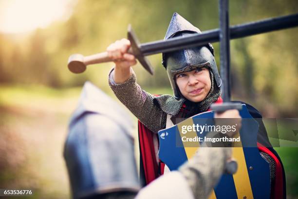 tough girl knight fighting with enemy - traditional armour stock pictures, royalty-free photos & images