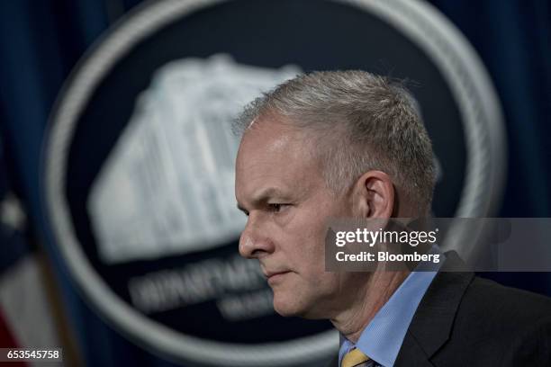 Vaughn Ary, director of the Justice Departments office of international affairs, listens during a news conference at the Department of Justice in...