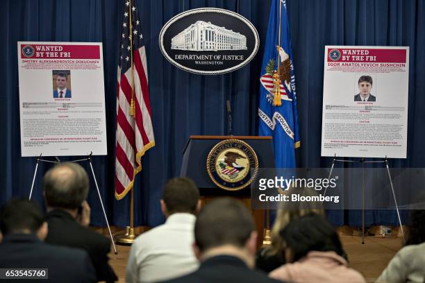 Wanted posters for Igor Anatolyevich Sushchin, right, and Dmitry Aleksandrovich Dokuchaev sit on display before a news conference at the Department...