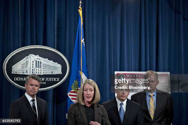 Mary McCord, acting U.S. Assistant attorney general for national security, center, speaks as Brian Stretch, U.S. Attorney for the northern district...