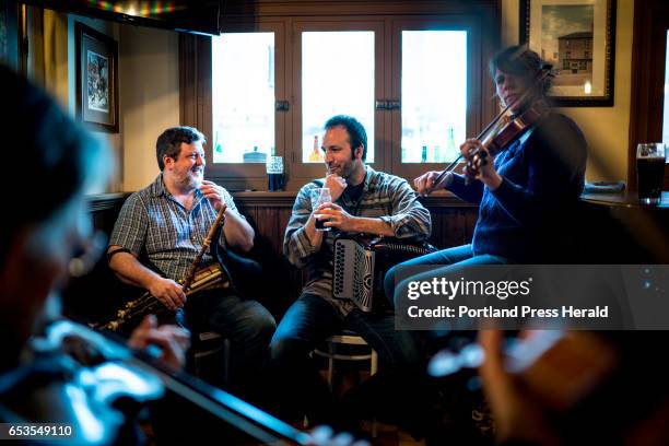 Tom Rota of South Portland, on the uileann pipes, Chris "Junior" Stevens, of Freeport, on the button accordion, and Jamie Eller of Portland, on the...