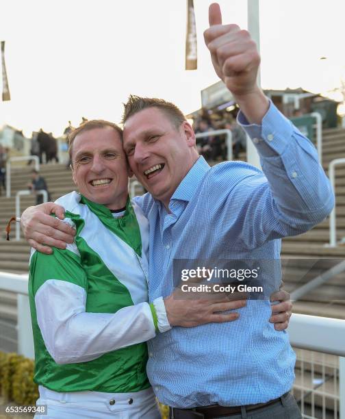 Cheltenham , United Kingdom - 15 March 2017; Jockey Jamie Codd celebrates with friend Ian O'Connell, from East Cork, after winning the Weatherbys...