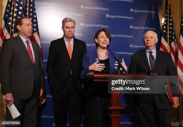 Sen. Amy Klobuchar speaks while flanked by Sen Ben Cardin , Sen. Sheldon Whitehouse and Sen. Tom Udall during a news conference, on Capitol Hill...