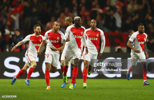 Kylian Mbappe of AS Monaco celebrates as he scores their first goal with team mates during the UEFA Champions League Round of 16 second leg match...