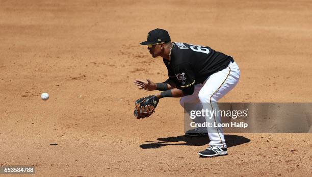 Jose Osuna of the Pittsburgh Pirates fields the ground ball during the fourth inning of a spring training game against the Baltimore Orioles on March...