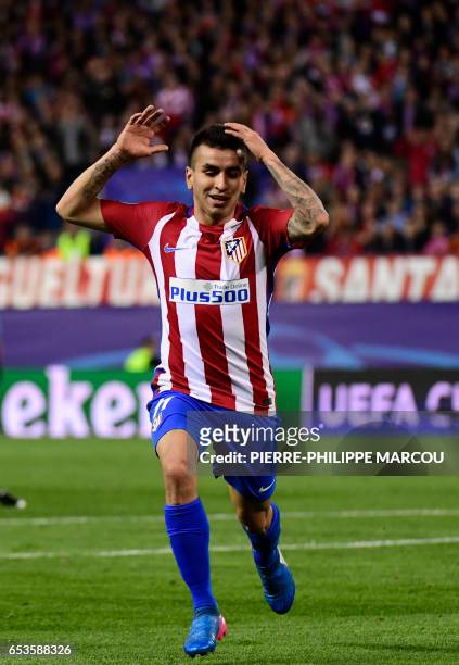 Atletico Madrid's Argentinian midfielder Angel Correa gestures after missing a shot during the UEFA Champions League round of 16 second leg football...
