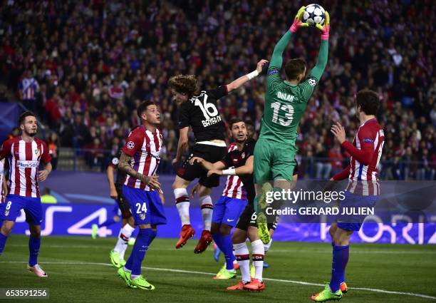 Atletico Madrid's Slovenian goalkeeper Jan Oblak stops a ball during the UEFA Champions League round of 16 second leg football match Club Atletico de...