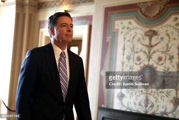 Director James Comey leaves a closed door meeting with Senators at the U.S. Capitol on March 15, 2017 in Washington, DC. Comey met with Sen. Dianne...