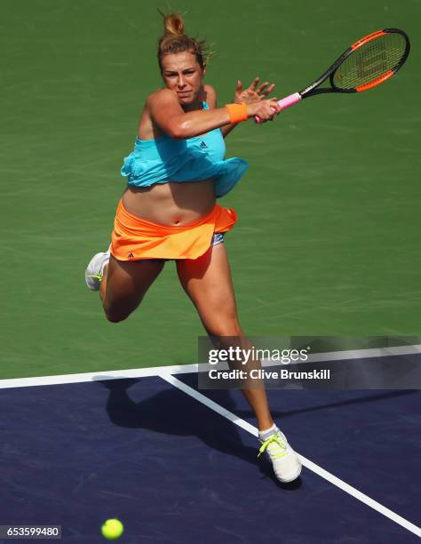 Anastasia Pavlyuchenkova of Russia plays a forehand against Svetlana Kuznetsova of Russia in the quarter final match during day ten of the BNP...