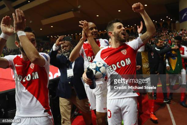 Bernardo Silva of AS Monaco celebrates victory with team mates Joao Moutinho and Fabinho after the UEFA Champions League Round of 16 second leg match...