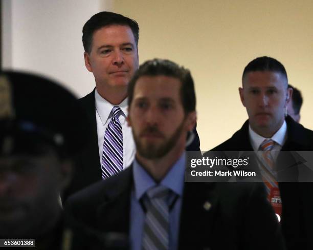 Director James Comey leaves a closed door meeting with Senators at the U.S. Capitol, March 15, 2017 in Washington, DC. Comey will testify in a public...