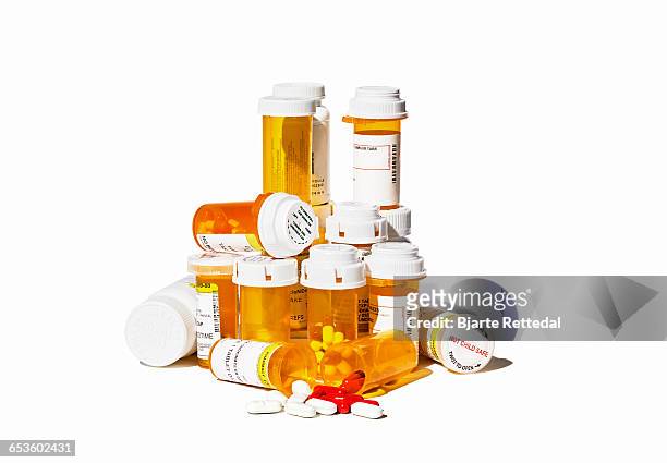 pile of prescription pills and bottles - prescription medicine stock pictures, royalty-free photos & images