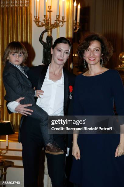 French Minister of Culture and Communication, Audrey Azoulay decorates Marie-Agnes Gillot , here with her son Paul, to the rank of "Chevalier de...
