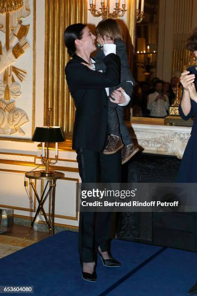Marie-Agnes Gillot, here with her son Paul, is decorated "Chevalier de lordre national de la Legion d'Honneur" at Ministere de la Culture In Paris on...
