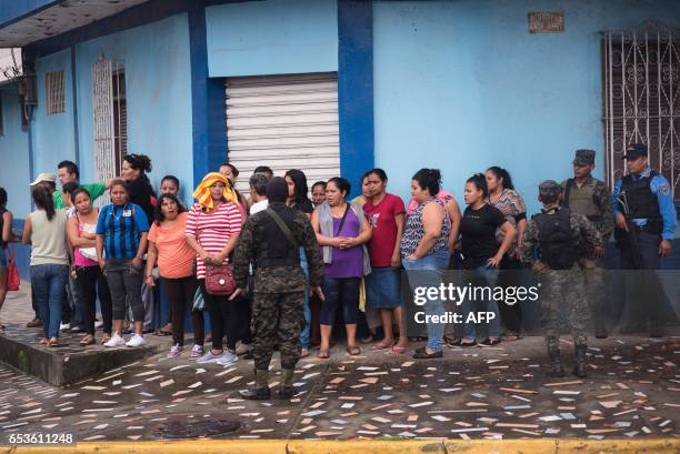 Relatives of prisoners watch the transfer of at least 755 members of the two main gangs, Barrio 18 and Mara Salvatrucha , from the San Pedro Sula...