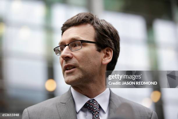 Washington State Attorney General Bob Ferguson address the media following a hearing about US President Donald Trump's travel ban at the US District...