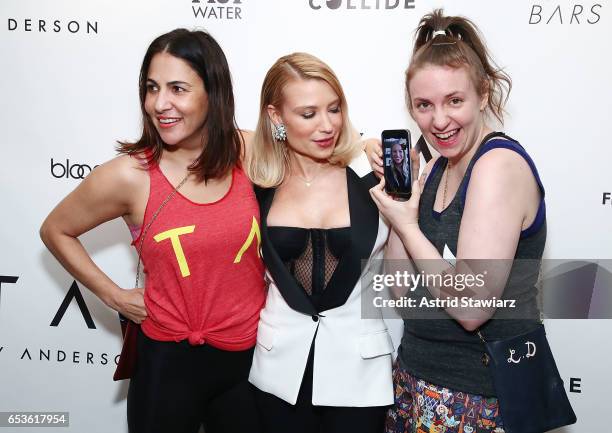 Director Jenni Konner, celebrity trainer Tracy Anderson and actress Lena Dunham hold with an iphone on facetime with actress Gwyneth Paltrow during...