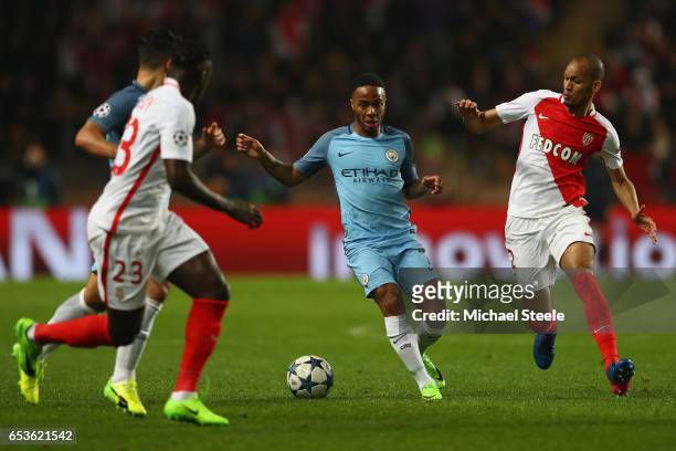 Raheem Sterling of Manchester City is tracked by Fabinho of Monaco during the UEFA Champions League Round of 16 second leg match between AS Monaco...