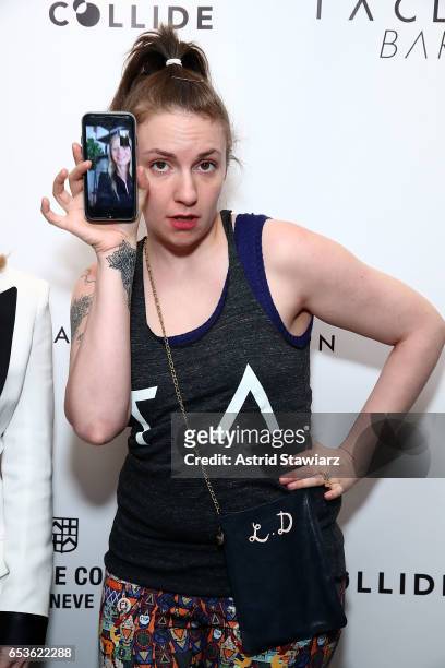 Actress Lena Dunham uses an iphone to facetime actress Gwyneth Paltrow during the celebration of the Tracy Anderson 59th Street studio on March 15,...