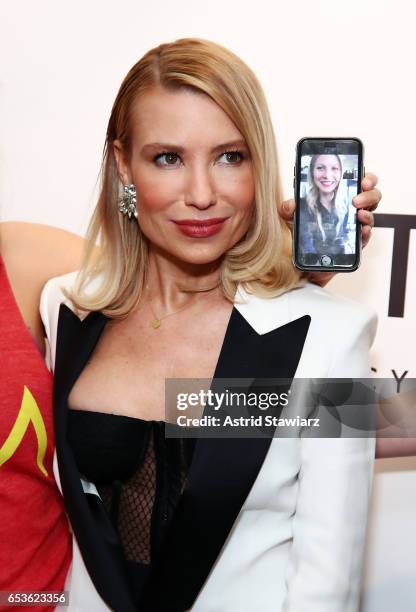 Celebrity trainer Tracy Anderson poses for photos with an iphone on facetime with actress Gwyneth Paltrow during the celebration of the Tracy...