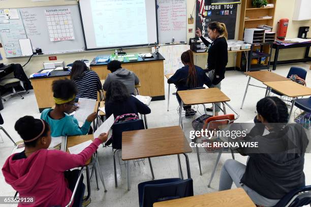 Science teacher Virginia Escobar-Cheng works with her students in a science class in a high school in Homestead, Florida, on March 10, 2017. Texas...