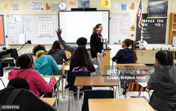 Science teacher Virginia Escobar-Cheng works with her students in a science class in a high school in Homestead, Florida, on March 10, 2017. Texas...