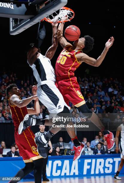 Emmitt Holt of the Providence Friars dunks the ball against Elijah Stewart of the USC Trojans in the first half of the First Four game in the 2017...