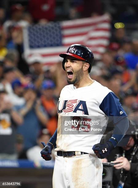 Eric Hosmer of the United States celebrates after hitting a two-run home run in eighth inning of the World Baseball Classic Pool F Game Two between...