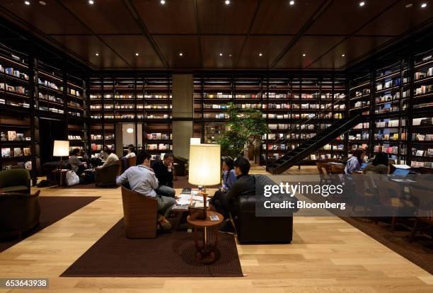 Employees work inside the reading room of Fast Retailing Co.'s Uniqlo City Tokyo office in Tokyo, Japan, on Friday, March 10, 2017. Uniqlo owner Fast...