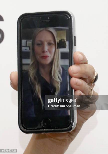 Actress Gwyneth Paltrow is on actress Lena Dunham's phone attend the Tracy Anderson Flagship Studio opening at Tracy Anderson Flagship Studio on...