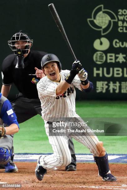 Nobuhiro Matsuda of Japan hits a RBI single to make it 0-8 in the bottom of the eighth inning during the World Baseball Classic Pool E Game Six...