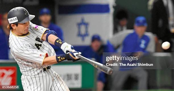 Nobuhiro Matsuda of Japan hits a RBI single to make it 0-8 in the bottom of the eighth inning during the World Baseball Classic Pool E Game Six...