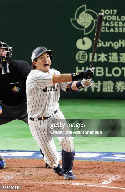 Infielder Nobuhiro Matsuda of Japan hits a RBI double to make it 0-2 in the bottom of the sixth inning during the World Baseball Classic Pool E Game...