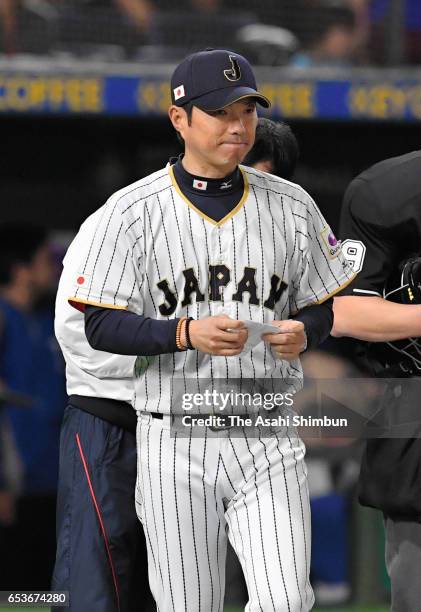 Manager Hiroki Kokubo of Japan calls a pitching change after the bottom of the fifth inning during the World Baseball Classic Pool E Game Six between...