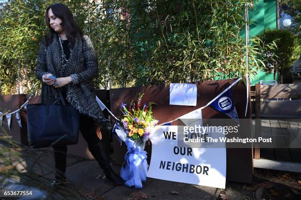 Meighan Stone leaves flowers and signs outside Comet Ping Pong on Monday Decmmber 05, 2016 in Washington, DC. A man identified as Edgar Maddison...