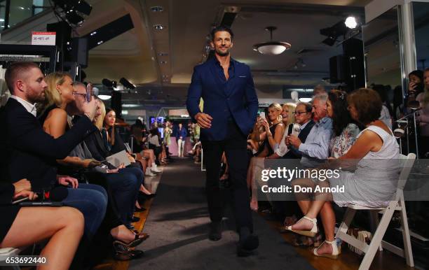 Anna Heinrich looks on as Tim Robards showcases designs during the Myer Fashion Runway show on March 16, 2017 in Sydney, Australia.